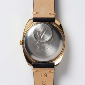 flatlay of the 1978 Timex Q Quartz, shown from the back