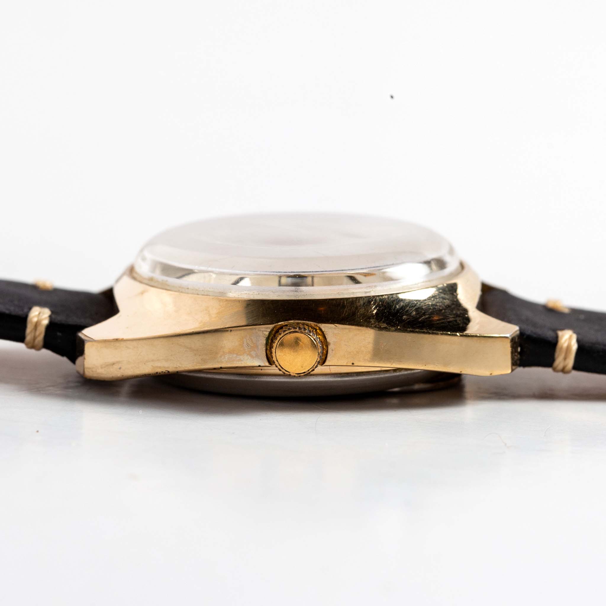 flatlay of the 1978 Timex Q Quartz, shown from the side, Accessories by Taylor Stitch
