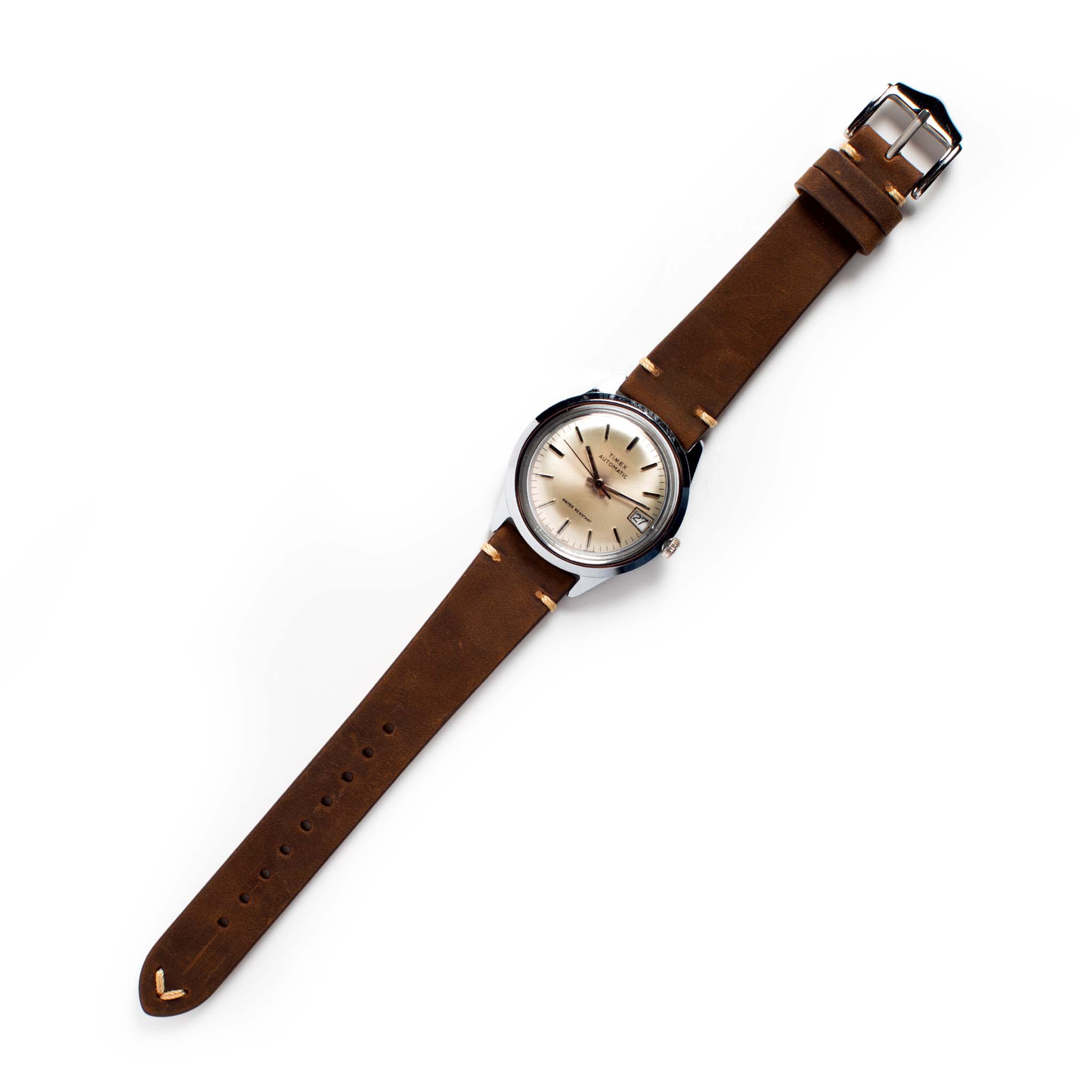 flatlay of the 1978 Timex Viscount M108, Accessories by Taylor Stitch