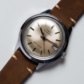 flatlay of  the 1978 Timex Viscount M108, shown close up