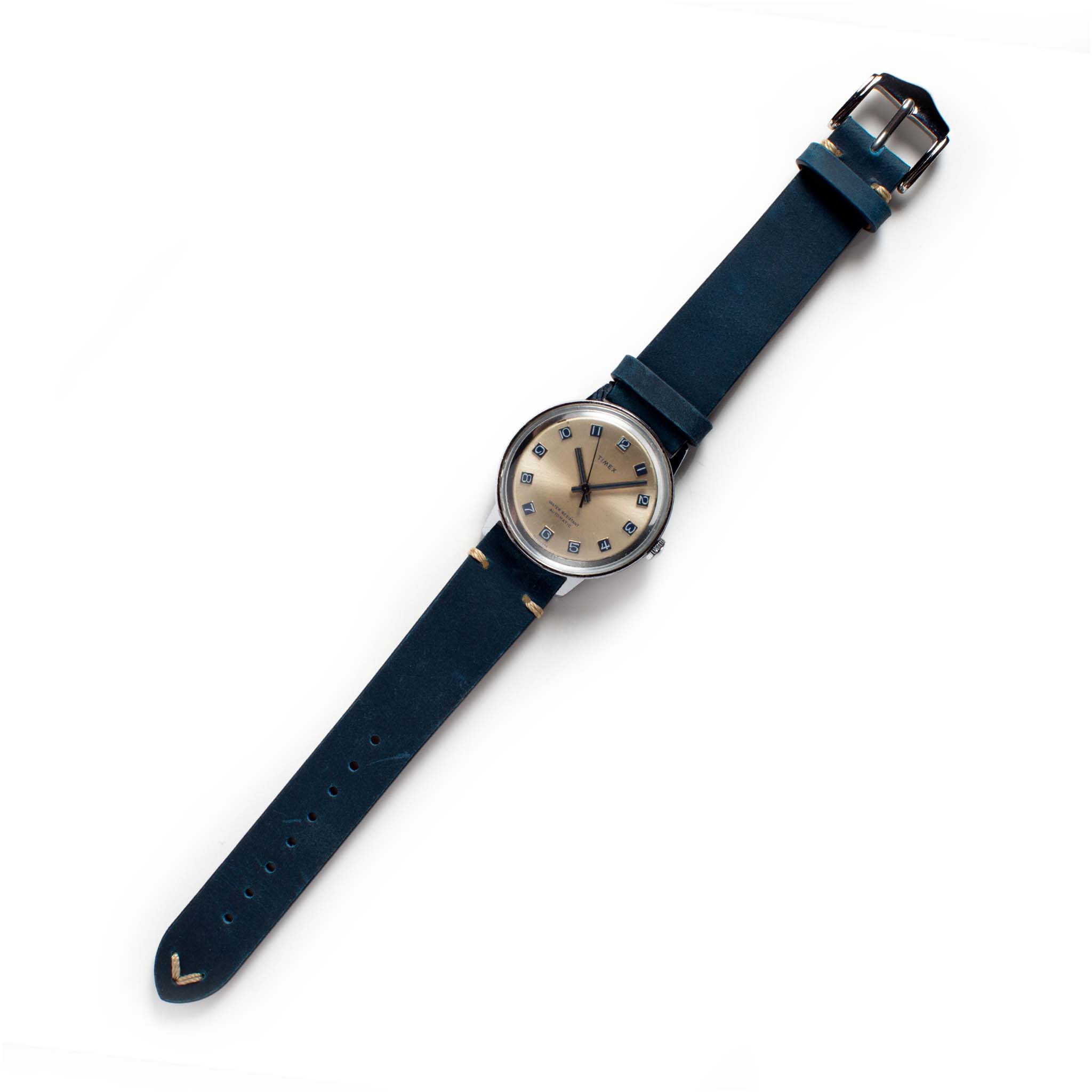 flatlay of the 1974 Timex Viscount M31, Accessories by Taylor Stitch