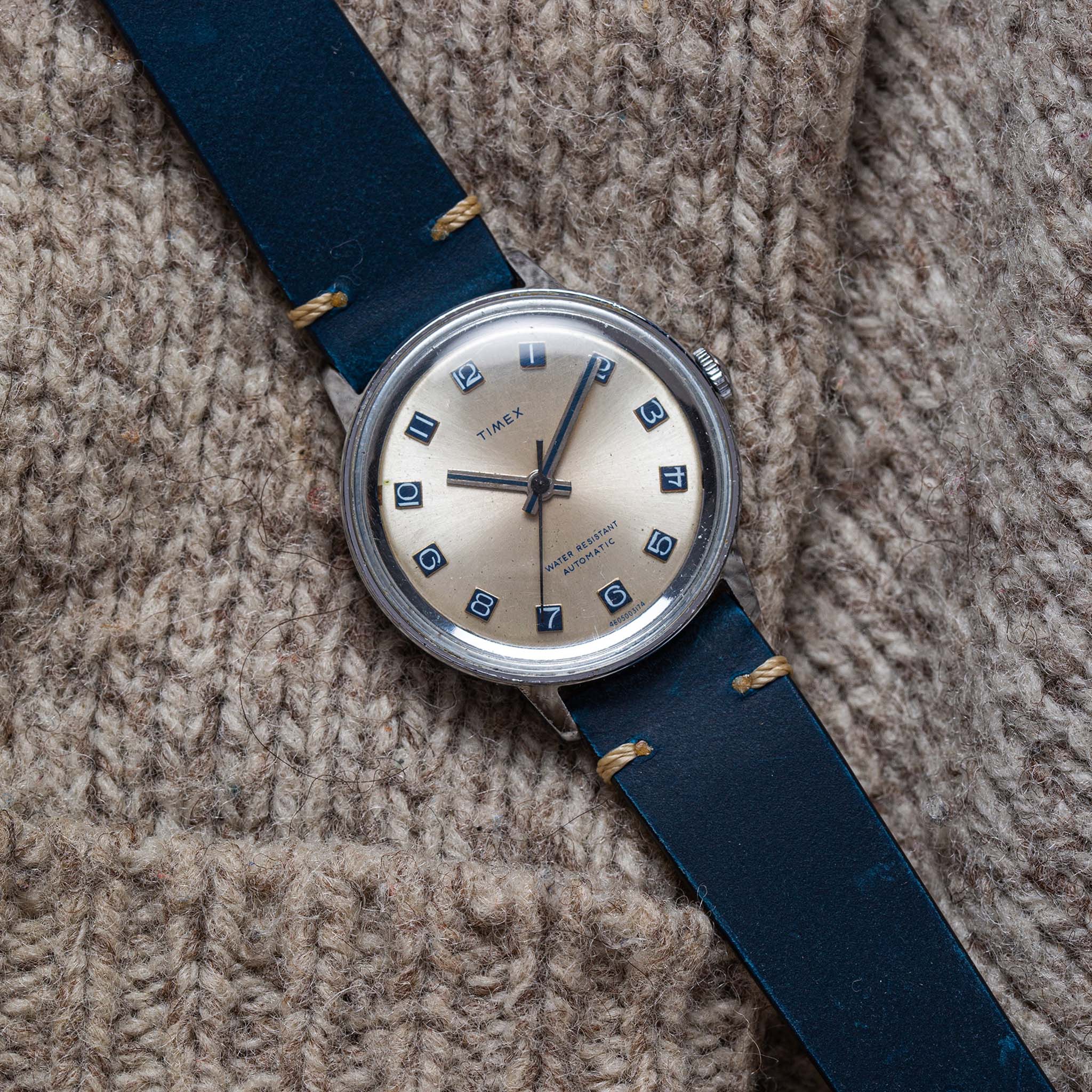 flatlay of the 1974 Timex Viscount M31 against a wool background, Accessories by Taylor Stitch