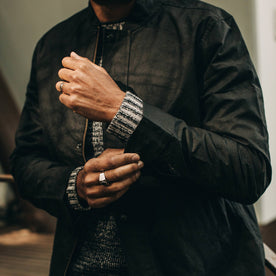 fit model wearing The Bomber Jacket in Black Dry Wax, sleeve