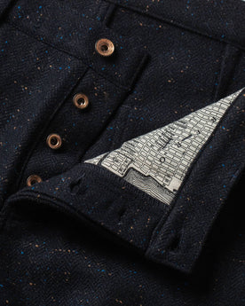 material shot of buttons and map interior , Bottoms by Taylor Stitch