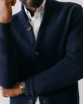 fit model rocking the The Crawford Sweater in Navy, standing by a car, Knits by Taylor Stitch