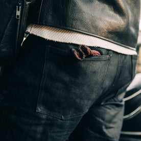 fit model wearing The Democratic Jean in Black Over-dye Selvage, back pocket