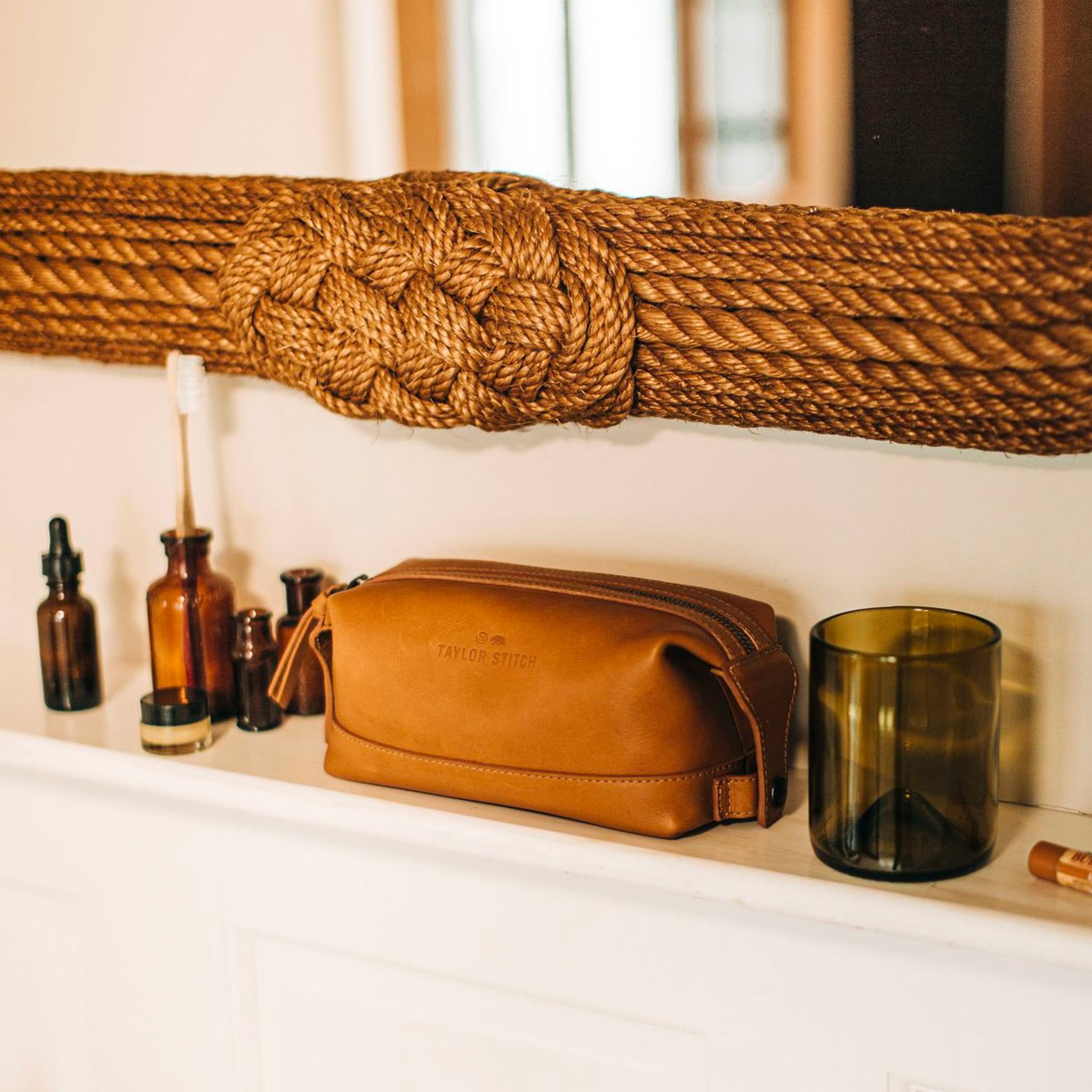 textural material shot of The Dopp Kit in Saddle Tan in bathroom, Accessories by Taylor Stitch