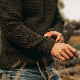 fit model wearing The Fisherman Sweater in Loden, sleeve shot