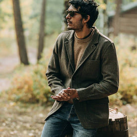 fit model wearing The Gibson Jacket in Olive Herringbone Wool, hands clasped