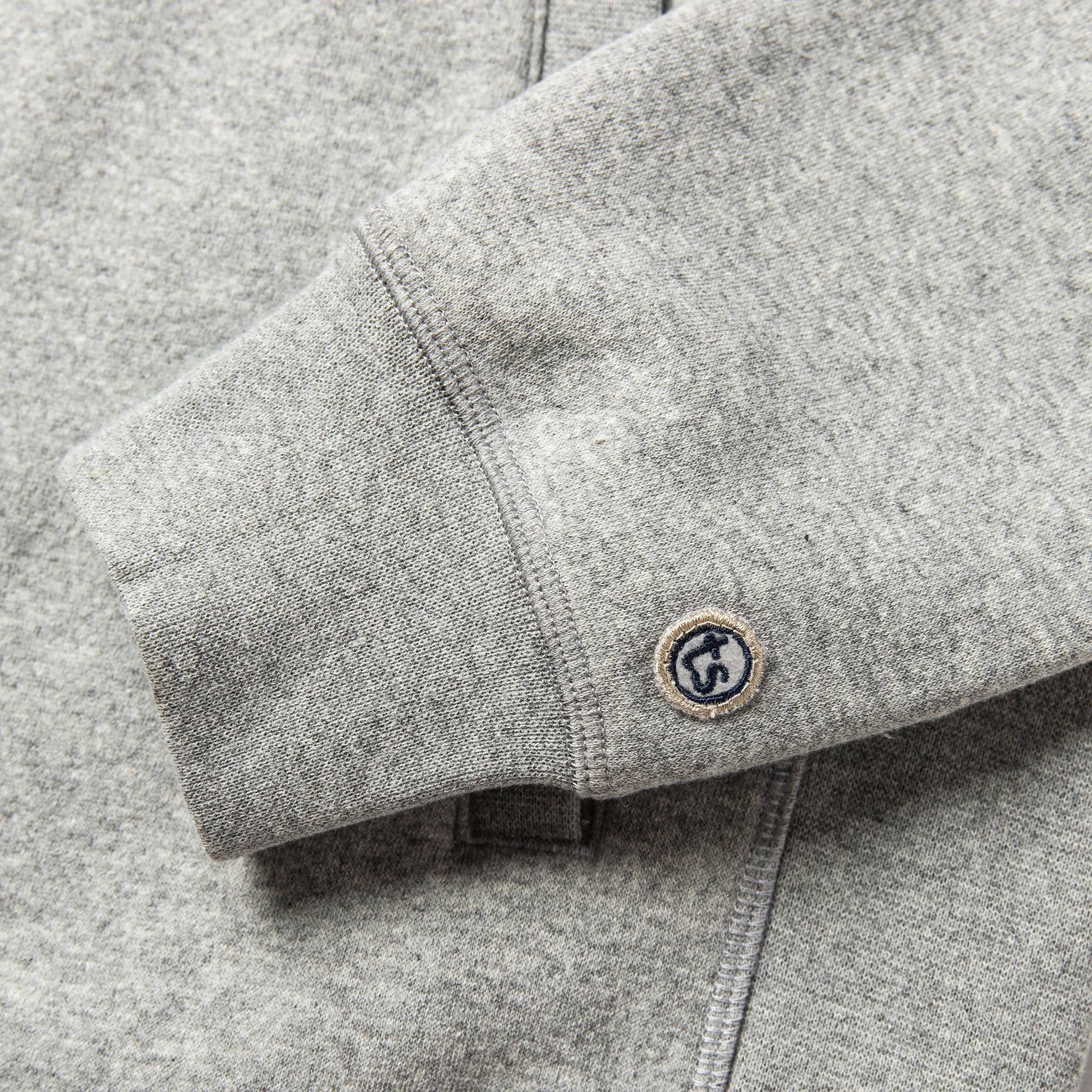 material shot of The Heavy Bag Bomber in Heather Grey Fleece's cuff with TS logo embroidery, Knits by Taylor Stitch