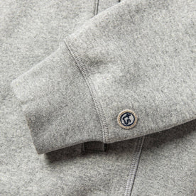 material shot of The Heavy Bag Bomber in Heather Grey Fleece's cuff with TS logo embroidery
