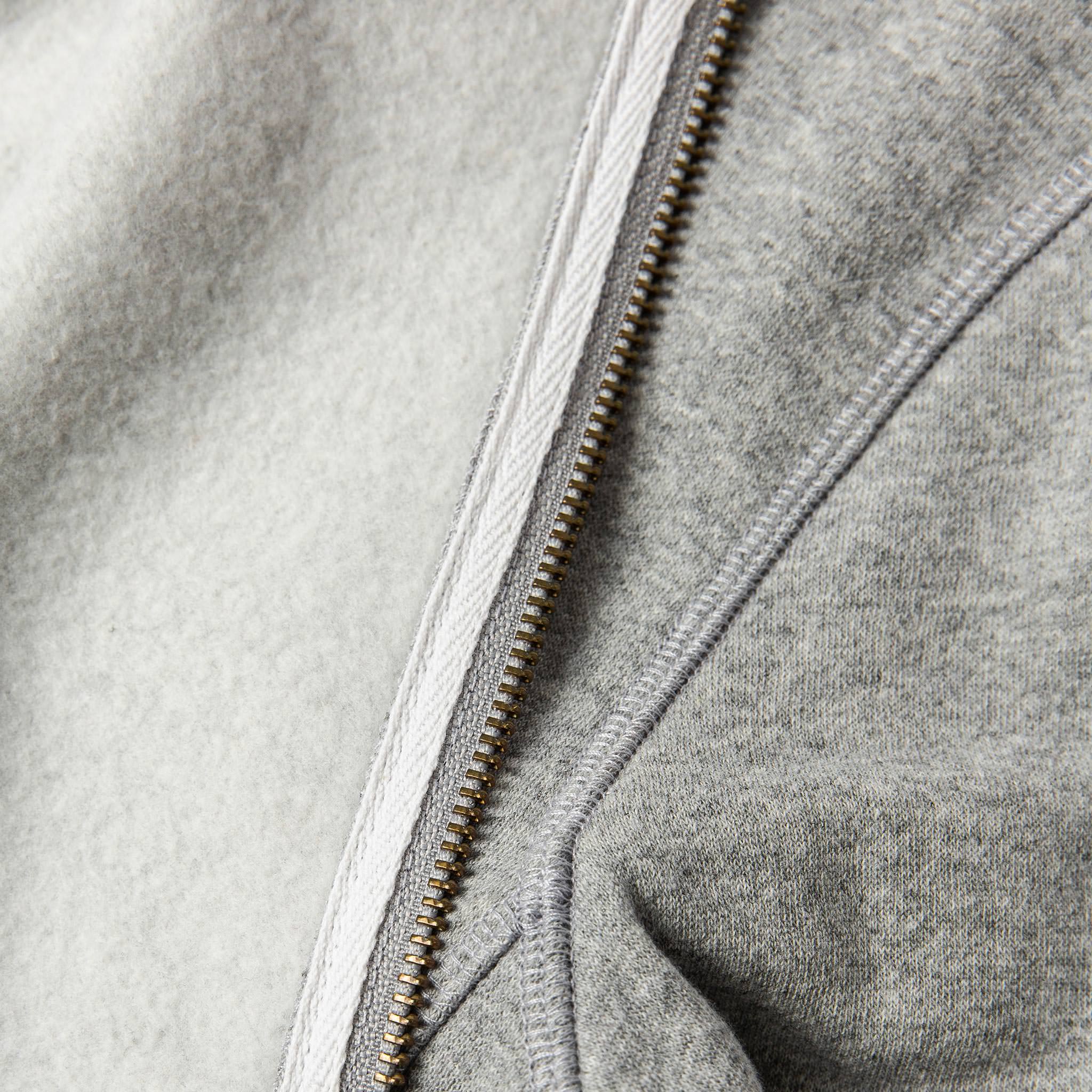 material shot of The Heavy Bag Bomber in Heather Grey Fleece with inside fleece visible and compared next to exterior, Knits by Taylor Stitch