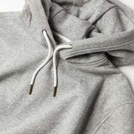 material shot of The Heavy Bag Hoodie in Heather Grey Fleece with pull hoodie drawstrings closeup