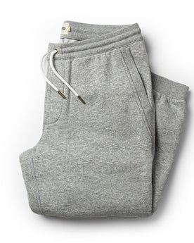 flatlay of The Heavy Bag Pant in Heather Grey Fleece folded up from the front, Pants by Taylor Stitch
