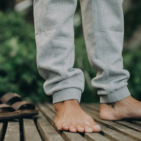 our fit model wearing The Heavy Bag Pant in Heather Grey Fleece closeup of ankle cuffs