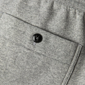 material shot of back pocket and horn button closeup of The Heavy Bag Pant in Heather Grey Fleece