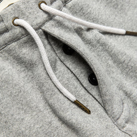 material shot of The Heavy Bag Pant in Heather Grey Fleece's hidden button fly