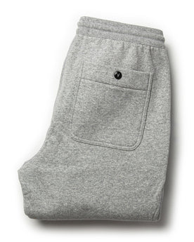 flatlay of The Heavy Bag Pant in Heather Grey Fleece from the back with back pocket shown, Pants by Taylor Stitch