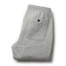 flatlay of The Heavy Bag Pant in Heather Grey Fleece from the back with back pocket shown
