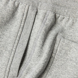 material shot of The Heavy Bag Short in Heather Grey Fleece showing diversity of stitching along the side seam with the ribbing detailing of the diagonal pockets