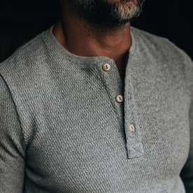 our fit model wearing The Heavy Bag Waffle Henley in Ash—cropped shot of buttons
