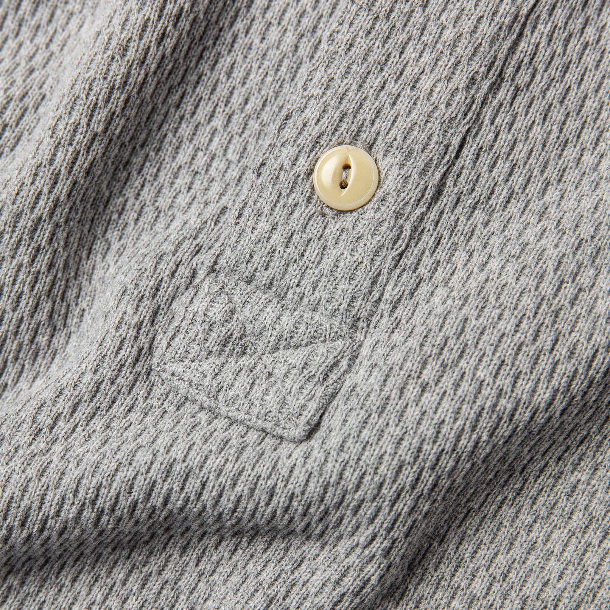 material shot of button, Knits by Taylor Stitch