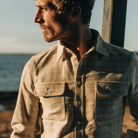 fit model wearing The Ledge Shirt in Sand Plaid, looking left