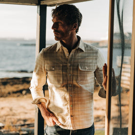 fit model wearing The Ledge Shirt in Sand Plaid, looking left, hand in pocket