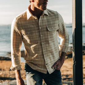 fit model wearing The Ledge Shirt in Sand Plaid, looking right, cropped shot nose down
