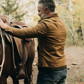 fit model wearing The Lined Long Haul Jacket in Harvest Tan Dry Wax, back