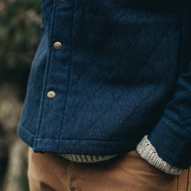 fit model wearing The Quilted Jacket in Indigo Boss Duck, hands in pockets