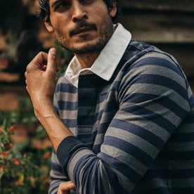 fit model wearing The Rugby Shirt in Navy Stripe, left arm shot