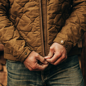 fit model wearing The Vertical Jacket in British Khaki Dry Wax, zipper