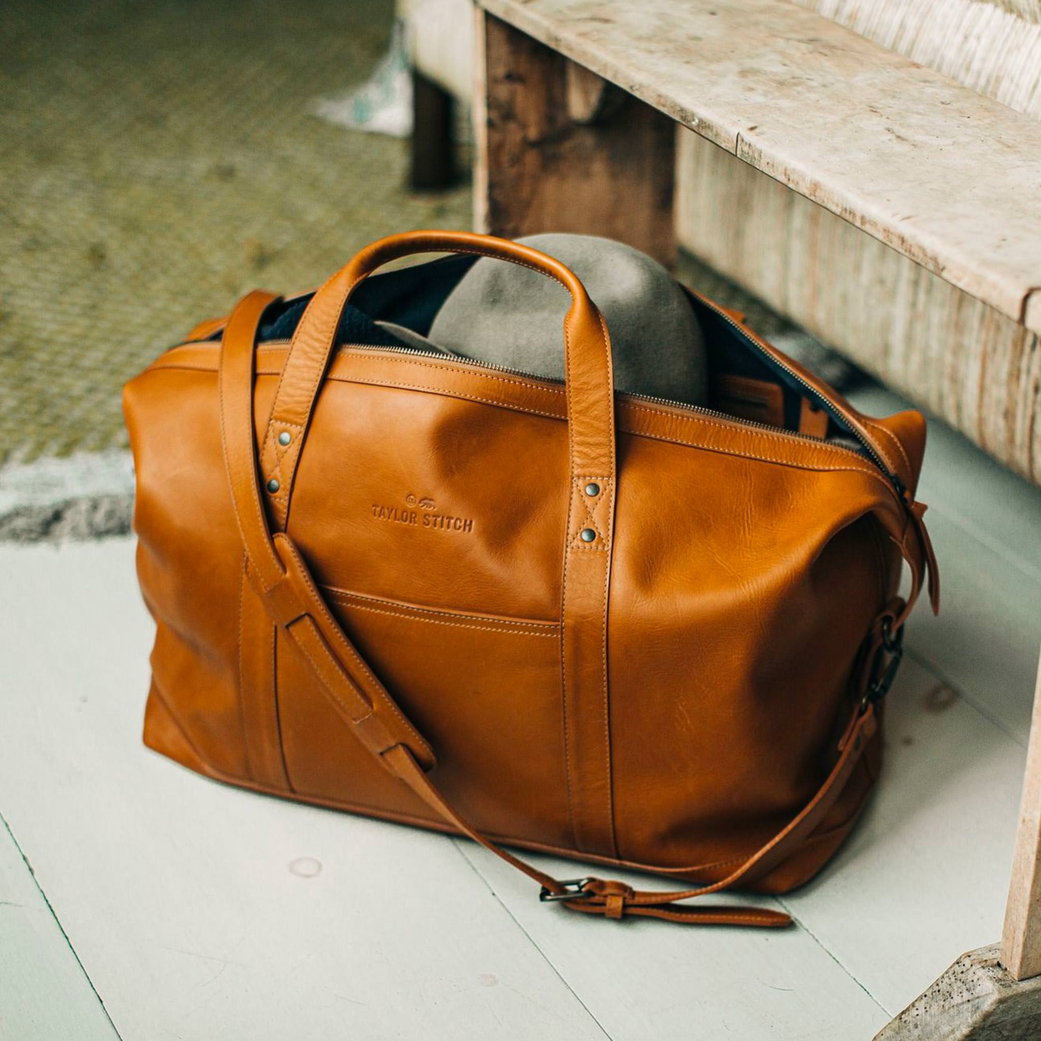 outdoor material shot of The Weekender Duffle Bag in Saddle Tan, Accessories by Taylor Stitch
