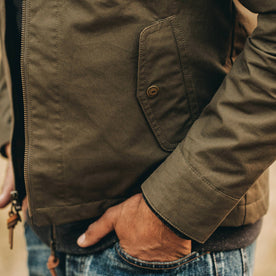 our fit model wearing The Welterweight Winslow in Olive Dry Waxed Canvas—cropped shot of pocket