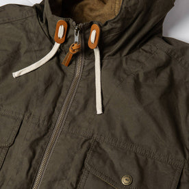 material shot with jacket zipped up