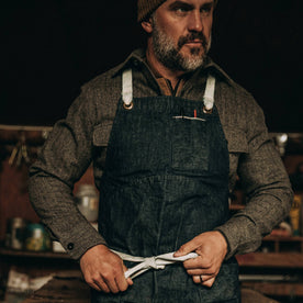 fit model wearing The Work Apron in Cone Mills Selvage, tying knot