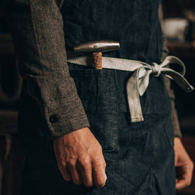 fit model wearing The Work Apron in Cone Mills Selvage, hammer in pocket