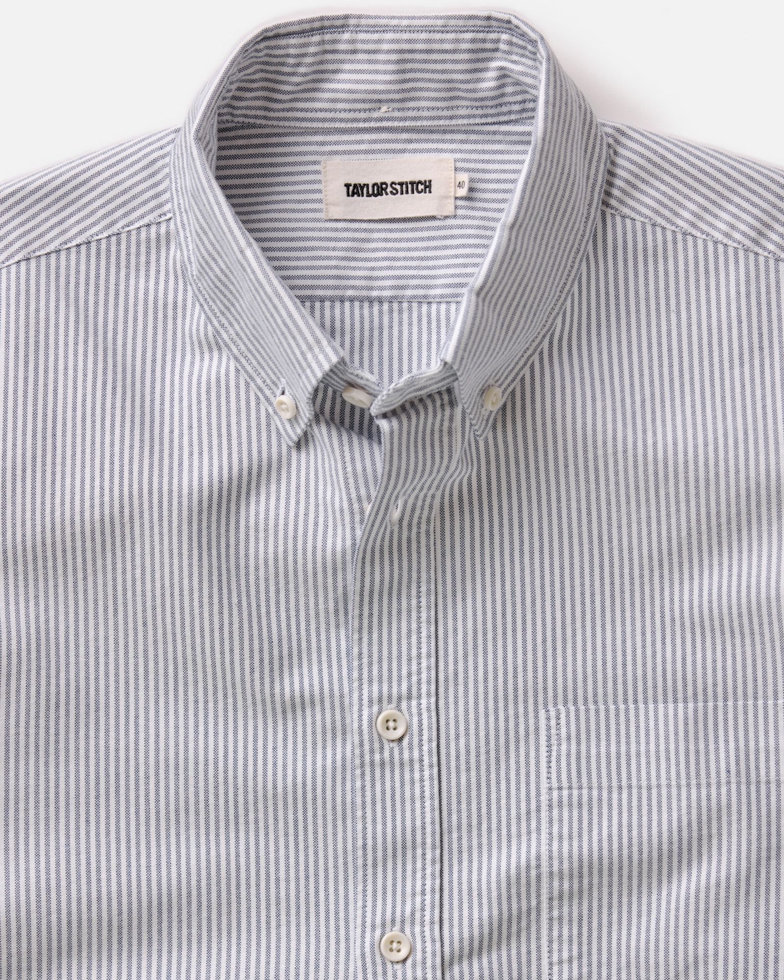 flatlay of The Jack in Navy University Stripe Everyday Oxford, shown in full, Wovens by Taylor Stitch