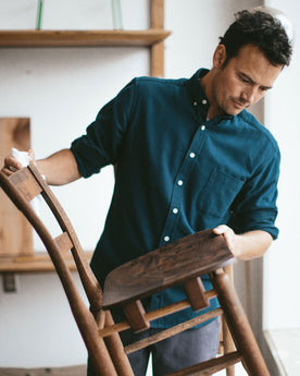 Patric looking over the chair he made, Wovens by Taylor Stitch