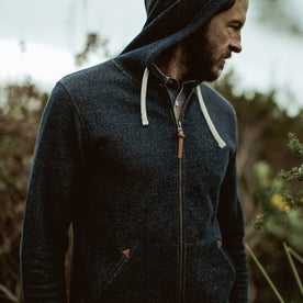 Our fit model wearing The Après Hoodie in Navy from Taylor Stitch.