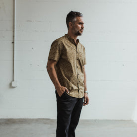 Our fit model wearing the Short Sleeve Bandit in Fatigue Brown Mini Floral in a San Francisco apartment. 