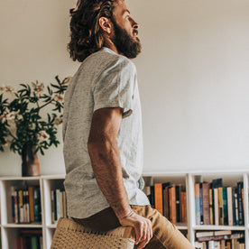 Our fit model in his library wearing The Short Sleeve Bandit in Heather Grey.