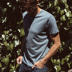Our fit model wearing The Antoni Tee in Heather Blue by Taylor Stitch.