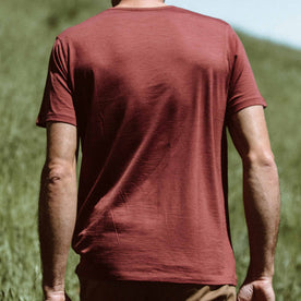 Our fit model wearing The Antoni Tee in Heather Brick by Taylor Stitch.