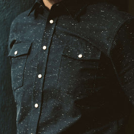 Close up of the buttons on the Glacier Shirt worn by our fit model
