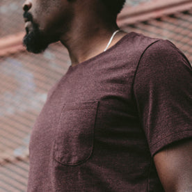 A close up of our fit model wearing the Burgundy Tee