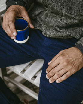 The ft model relaxing in his moleskin camp pants, Pants by Taylor Stitch