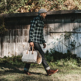 Our fit model wearing The Leeward Shirt while carrying his bag.