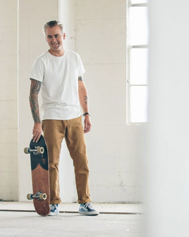 James about to skateboard , Pants by Taylor Stitch